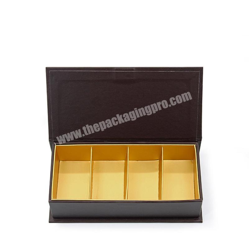 Black Chocolat Paper Box with inside gold film tray and gold foiling logo