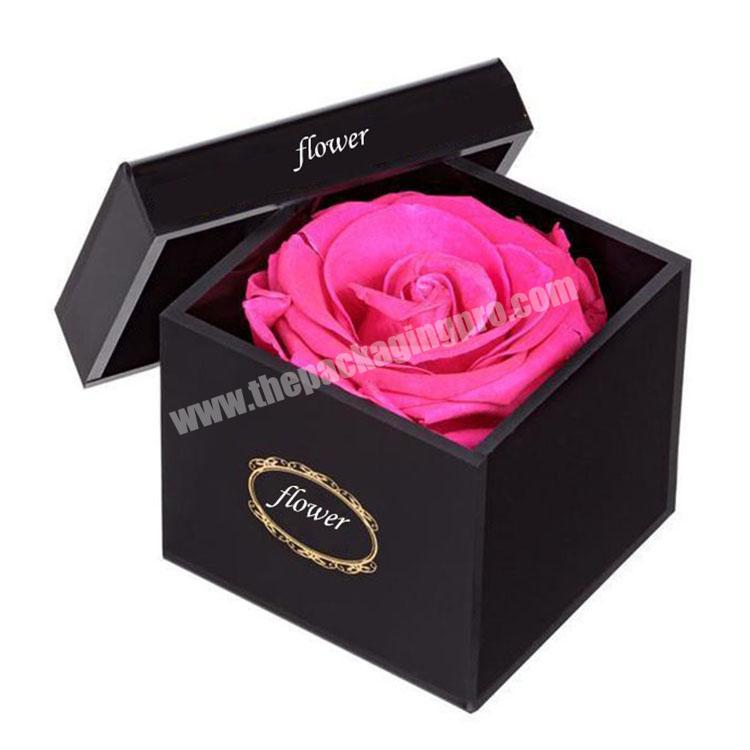 Black round flower gift box packaging with gold foil logo