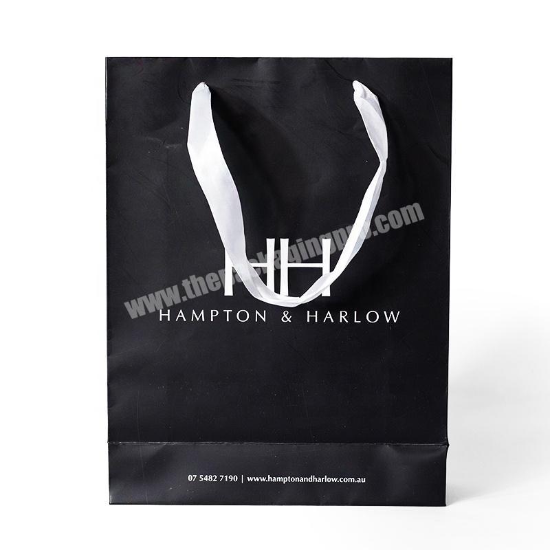 China factory cheap custom made simple design black matte bag with ribbon handle