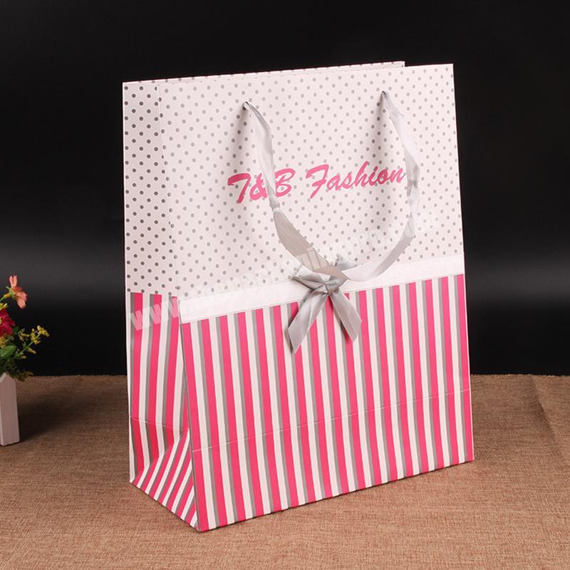 China Factory customized handle paper carrier bag new ivory board packing bag clothing shopping paper bag
