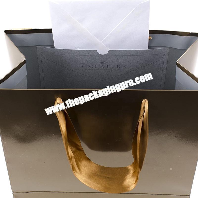 China gift paper bag with custom made clothing printing bronzing logo