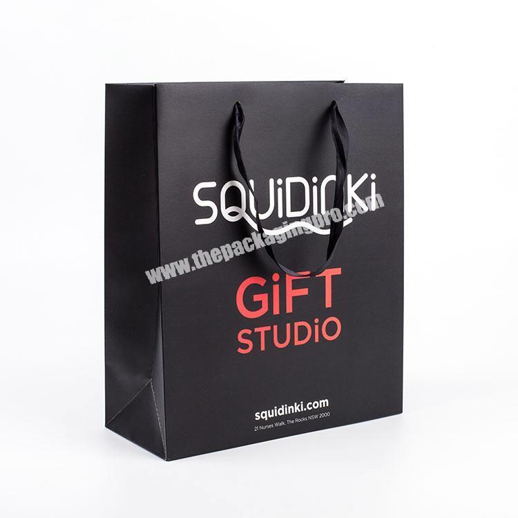 China Manufacturers Wholesale Cheap Custom Design Shopping Paper Bags With Your Own Logo