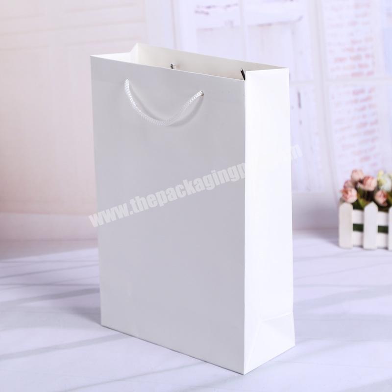 China Supplier White Simple Printed Gift Foldable Shopping Paper Bag Carrier Bag With Your Own Logo