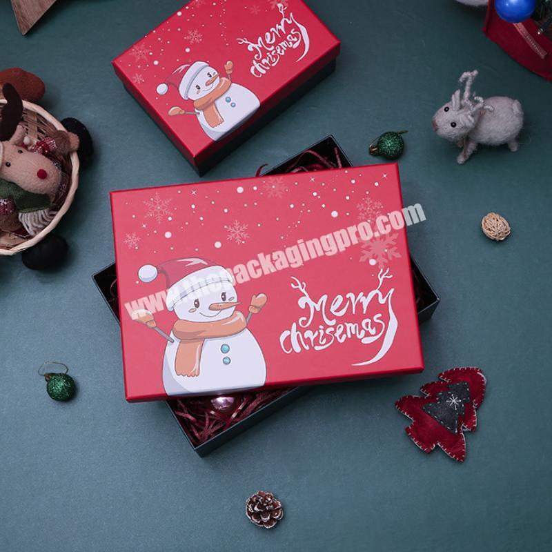 Christmas paper gift box with surface printing Santa Claus and Christmas tree