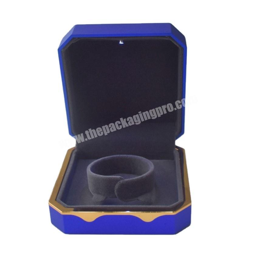 Crepack stylish and fashionable LED light octangle shape Blue color Bracelet box with Bronze color rim box size 10 x 10 x 5cm