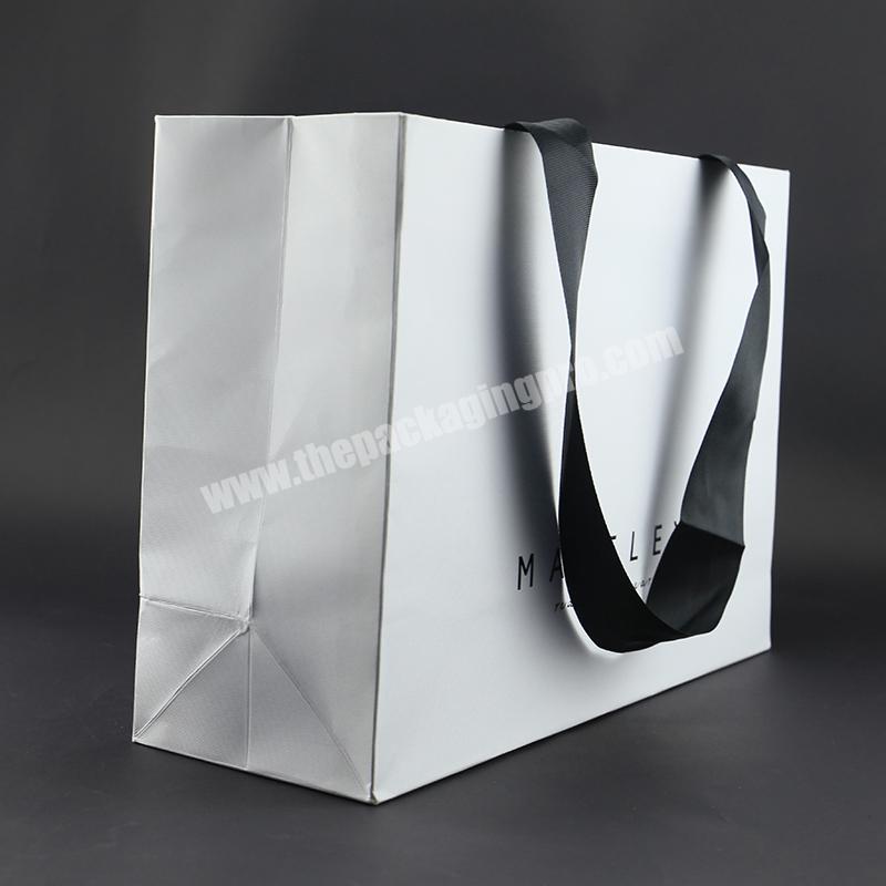 Custom Black Logo Printed White Elegant Shopping Clothes Packaging Bag Paper With Ribbon Decoration Reusable