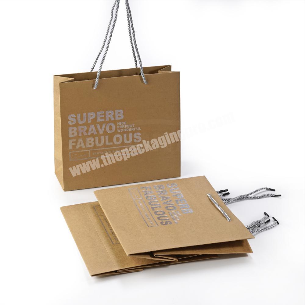 custom brown kraft paper bag with silver foil logo, customized craft shipping bag with drawstrign handles