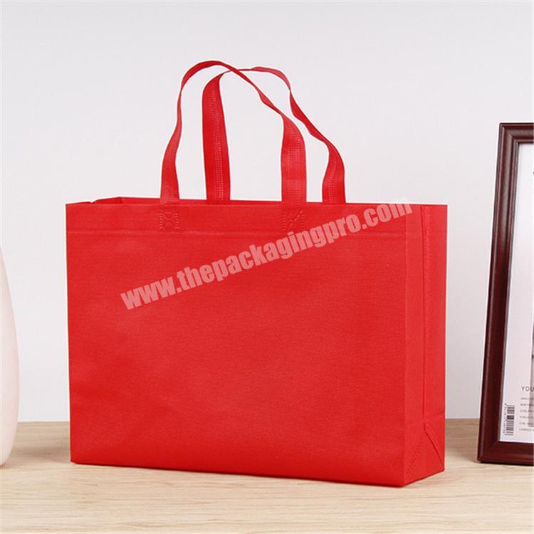 Custom cheap quality red non woven with your logo for clothing