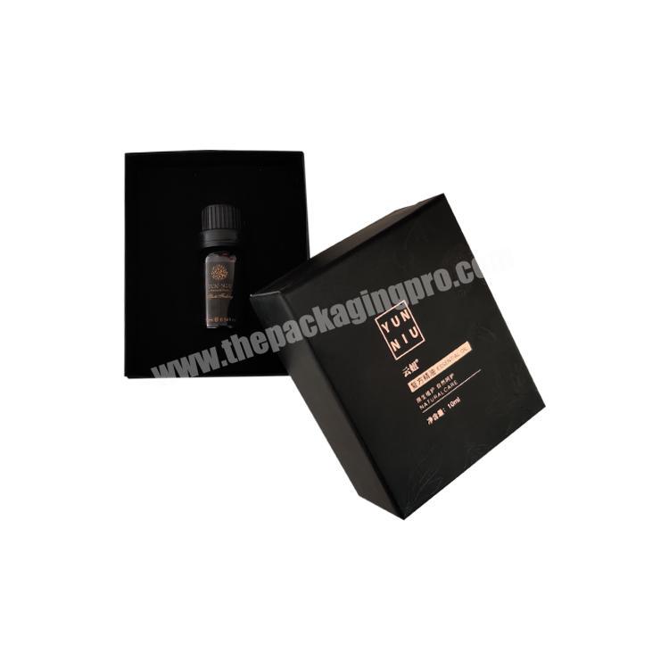 Custom closed frosted paper gift box with upper and lower lids with glossy black UV coated logo