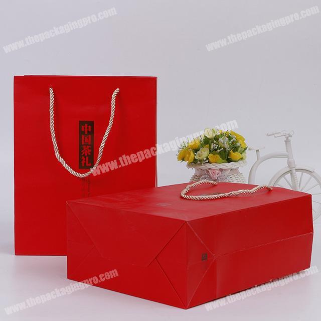 Custom creative fine white cardboard mall shopping tea package gift paper bag