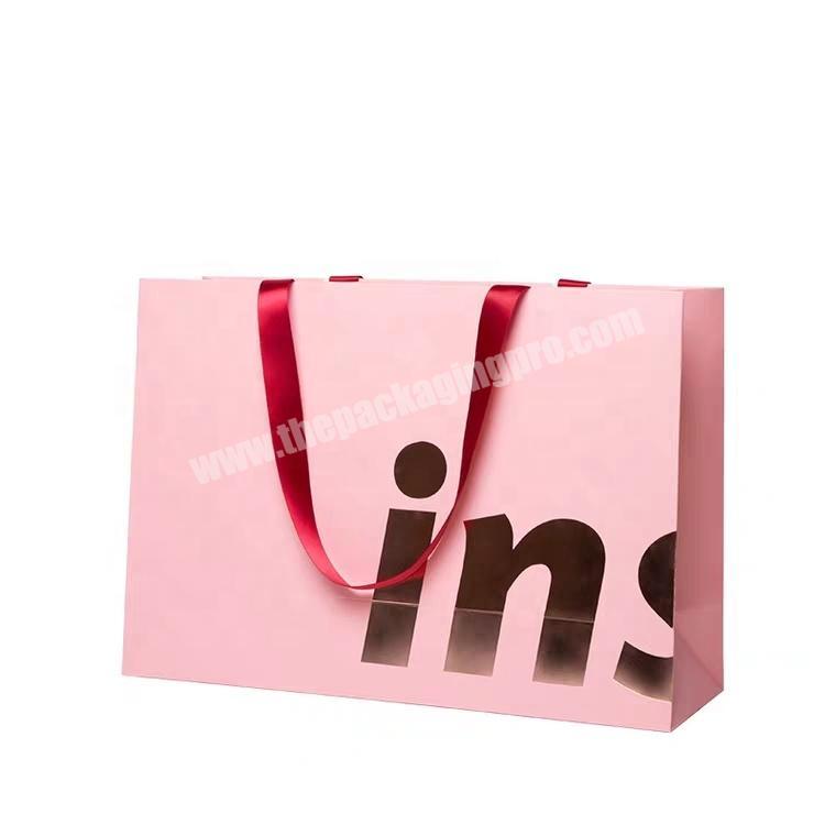 custom foil stamping logo luxury pink paper bag with ribbon handle