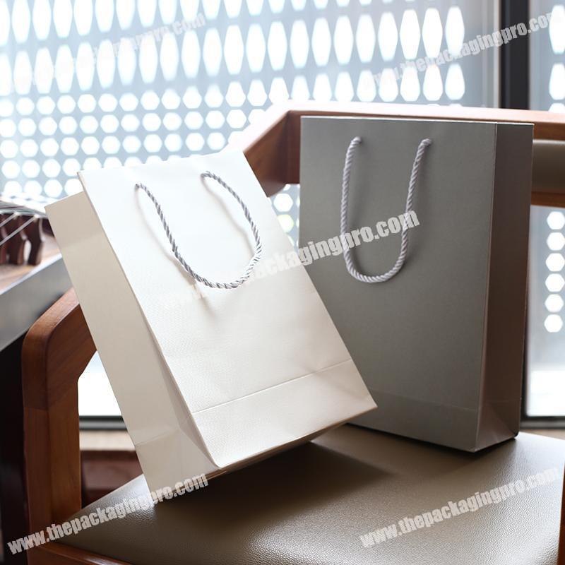 Custom high quality art paper packaging bag wholesale printing luxury apparel bag
