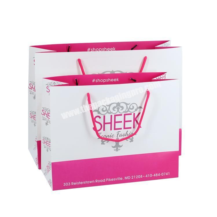 Custom logo 210gsm packaging bags , free sample paper pink shop bag for wholesale