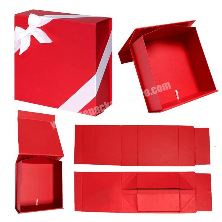 Custom LOGO cosmetics Red Rigid paper foldable gift packaging box with tie ribbon and magnet closure for easy to ship box
