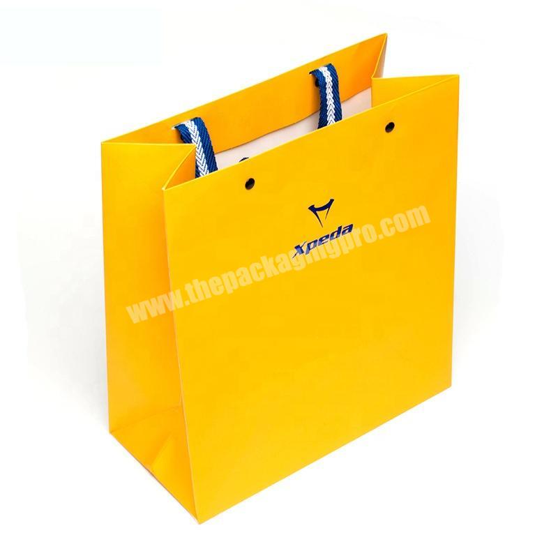 Custom logo printed paper gift garment shopping bags with rivet handles