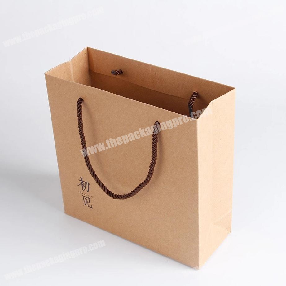 Custom logo printing kraft paper bag for festival gifts with handle.