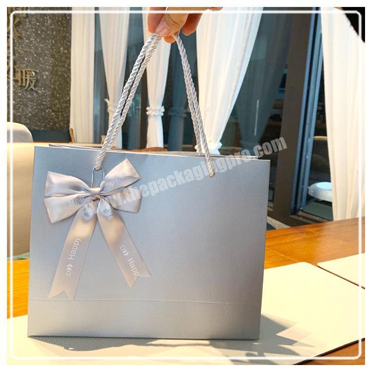 Custom Logo Stamping Silver Makeup Shopping Cosmetic Paper Gift bag Printing Foil Silver Packaging Bag with bowknot silk ribbon