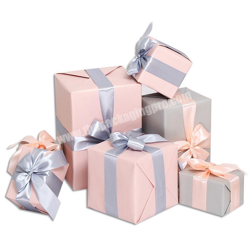 Custom matte pink paper packaging box for christmas gift package with ribbon
