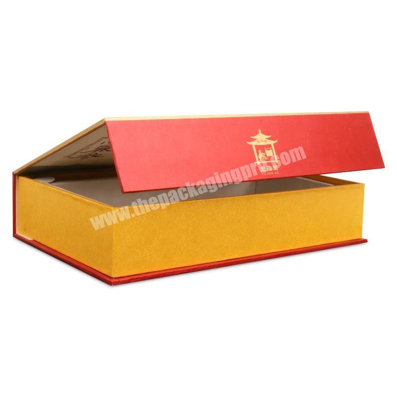 Custom print red color gold foil book shape magnetic closure cardboard gift box with white EVA foam insert