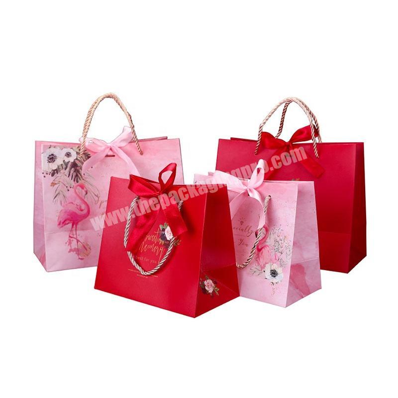 Custom Printed Foil Logo New Design Decorative Pink Gift Paper Bags Skincare Products Packaging Paper Bag With Beautiful Ribbon