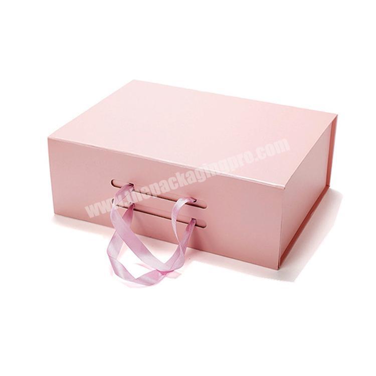 Customized pink cardboard book shape gift folding magnetic flap box wholesale with ribbon handle