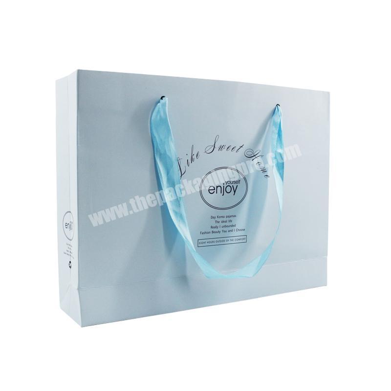 Customized recyclable blue folding women clothing gift packaging paper bag with ribbon  handle