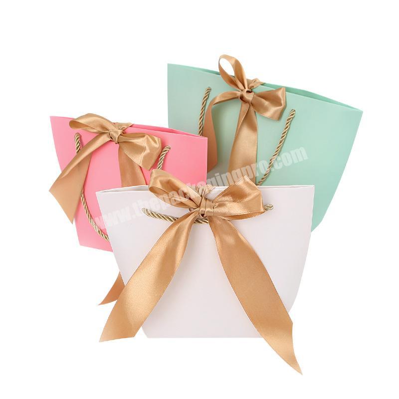 Cute custom cosmetic gift paper bag  wholesale with ribbon