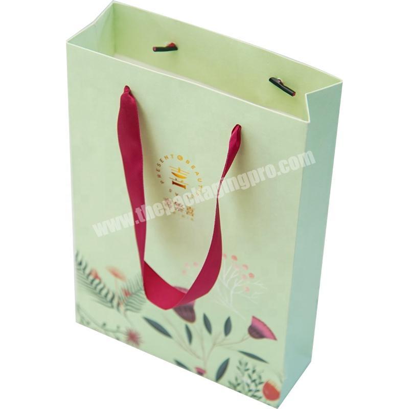 Dongming custom retail personalized paper goodies bags with die cut handles