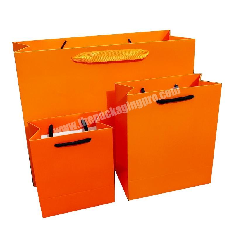 Dongming fashionable elegant custom made logo design printing gift packaging paper bag wholesale