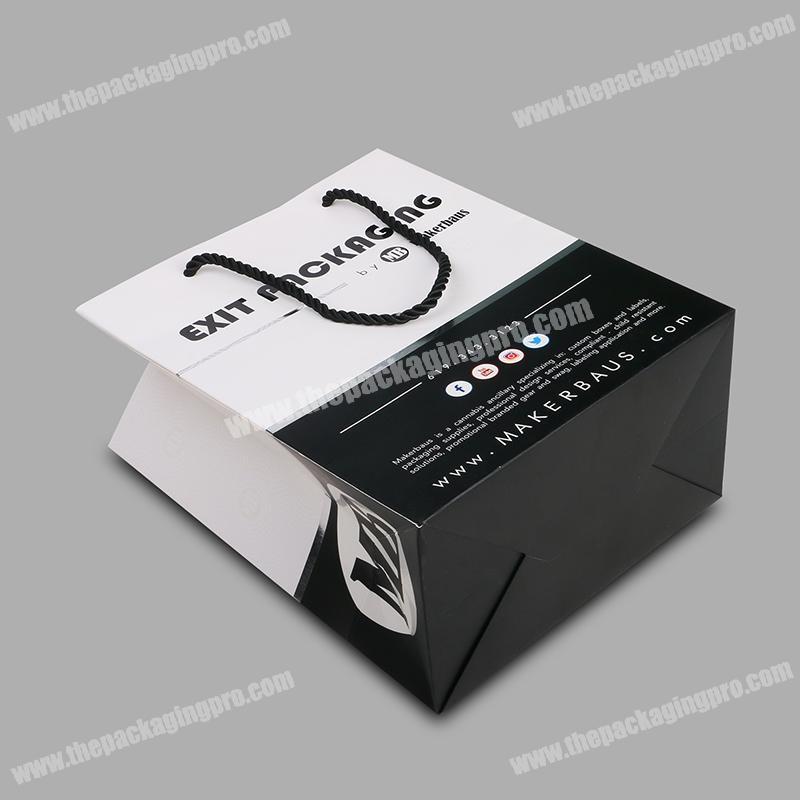 Eco-friendly custom design printed white paper packaging bag with ribbon handle
