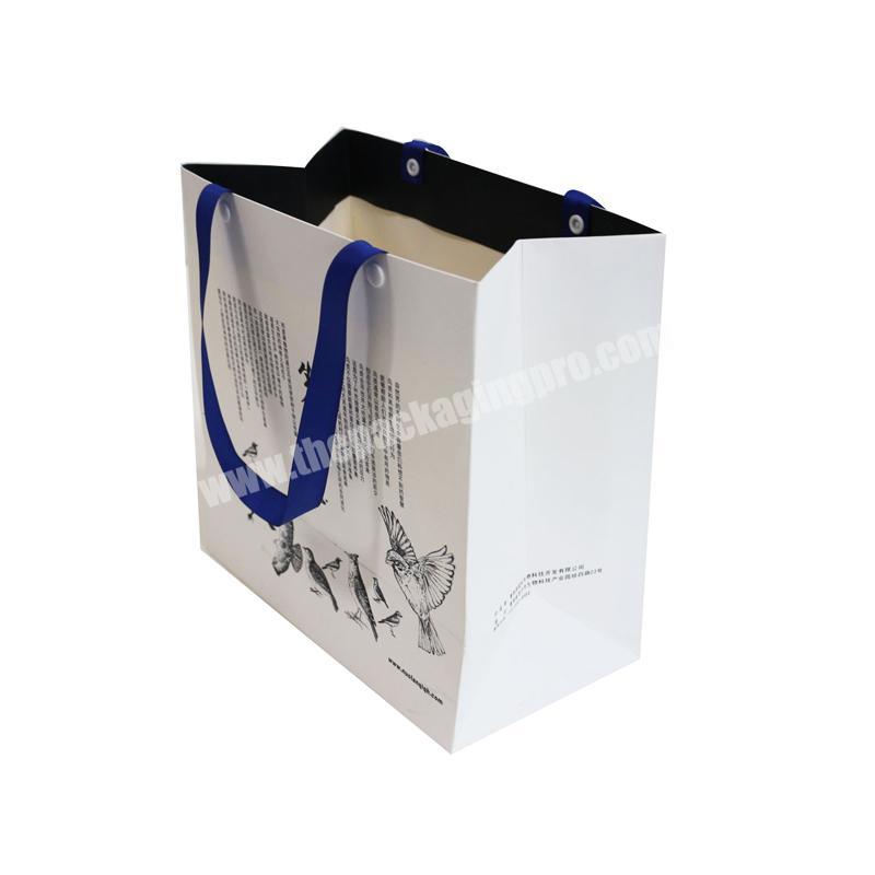 Environmental friendly recyclable custom white folding women cloth shopping paper bag for dresses hand bags