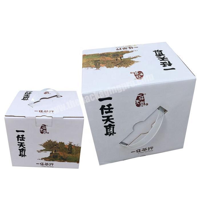Foldable corrugated paper packaging box with plastic handle