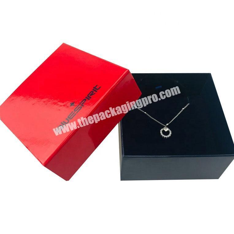glossy red top and black bottom necklace and earring set box with inlay and wrapping paper