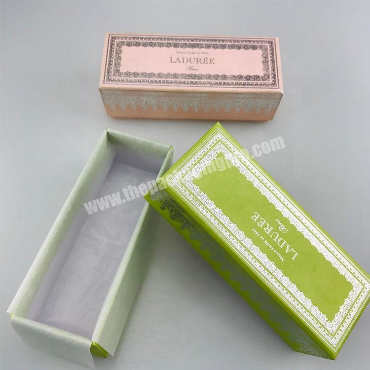 green color oblong lid and base dessert box with wrap paper inside cookie packaging