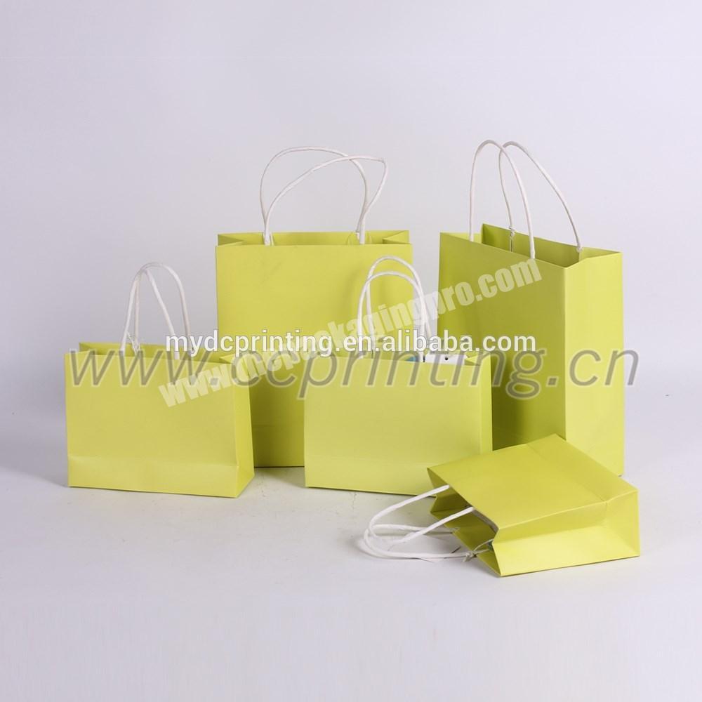 hand-held paper shopping bags yellow paper packet for garment