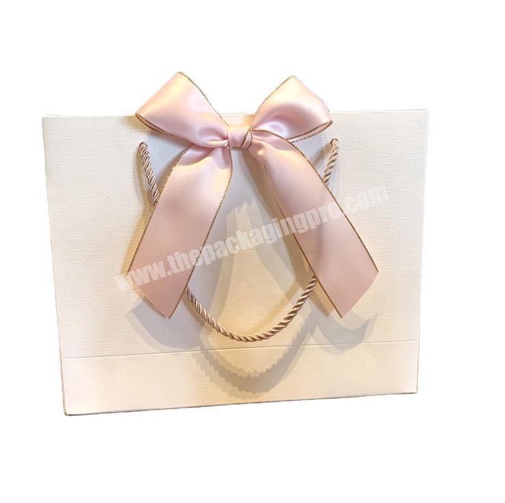 High-end portable paper bags custom printed hot logo embossed gift packaging bags clothing shopping bags
