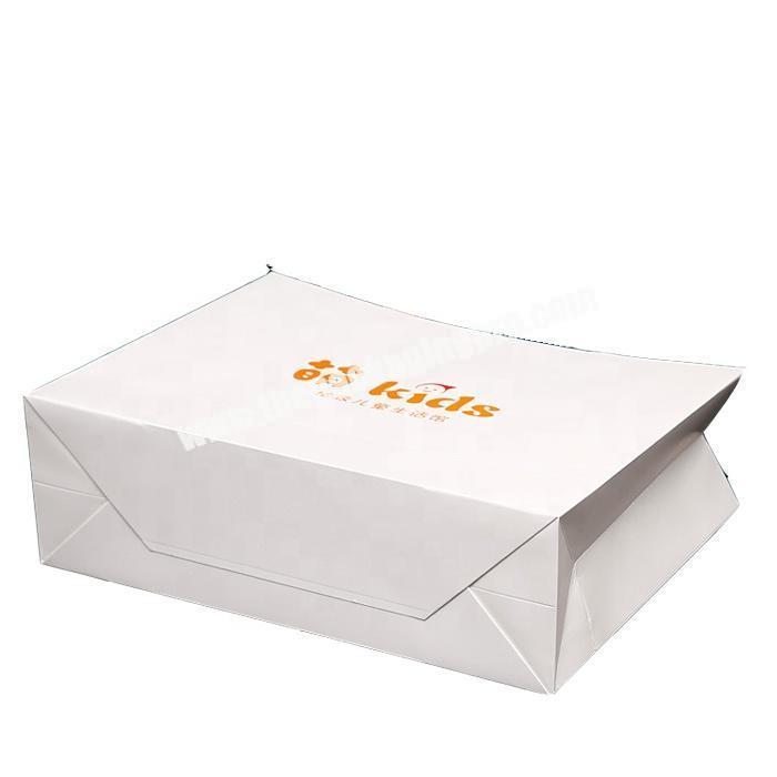 High quality customized paper kids clothing packaging bag with handle