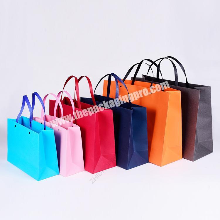 High quality eyelet strong handle mix colors customised paper bag with logo
