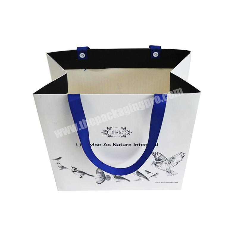 High quality recyclable customized white women clothing dresses sleepwear shopping paper bag with blue ribbon