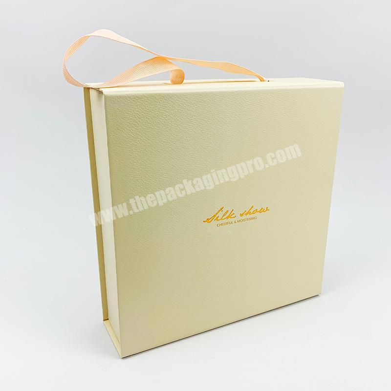 Hot sale custom design made luxury book shape magnetic cosmetic paper packaging  gift boxes EVA inside with ribbon handle