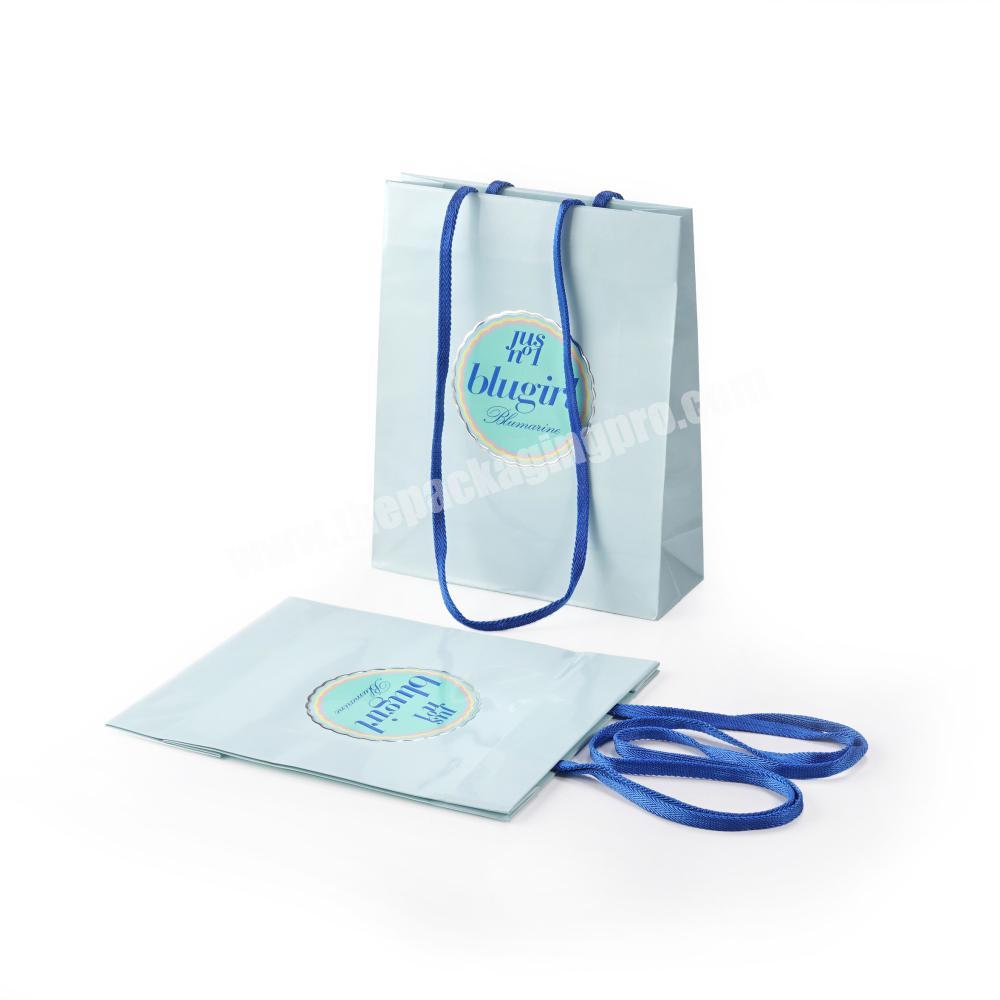 light turquoise shiny customize imprint art paper shopping bag with long strip webbing shoulder lenghth handle