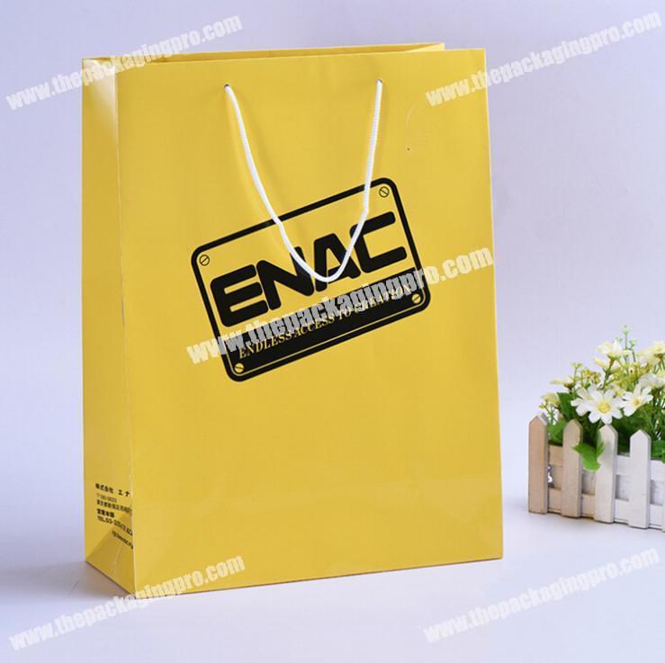 Low cost raw materials paper shopping bag with handle