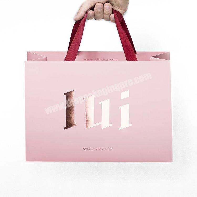 luxurious pink paperbag with logo custom gold foil stamping