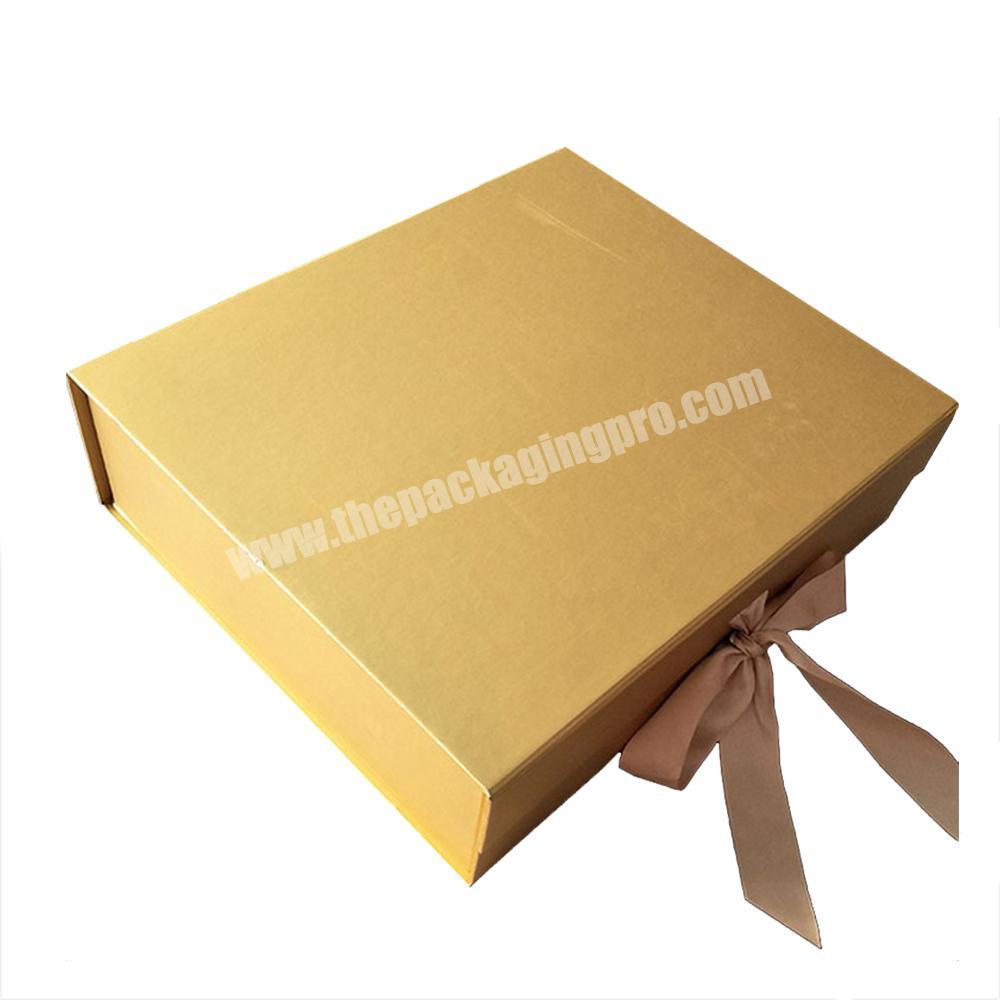 Luxury design gold foldable rigid cardboard dress packaging mystery magnet closed gift box with ribbon