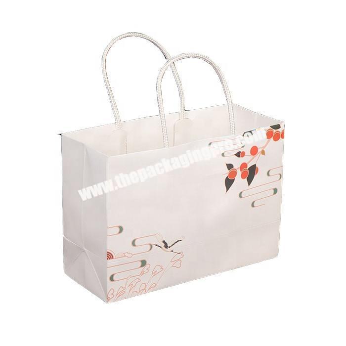 Luxury recycled paper packaging bag with ribbon handle