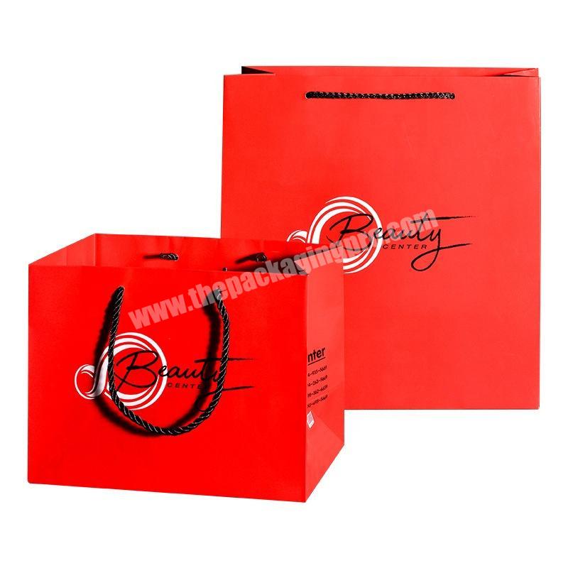 Luxury red paper shopping bag for cosmetic packaging