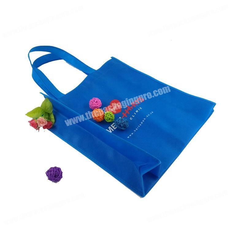 Machine sewing blue fabric reusable non woven bag with logo printing