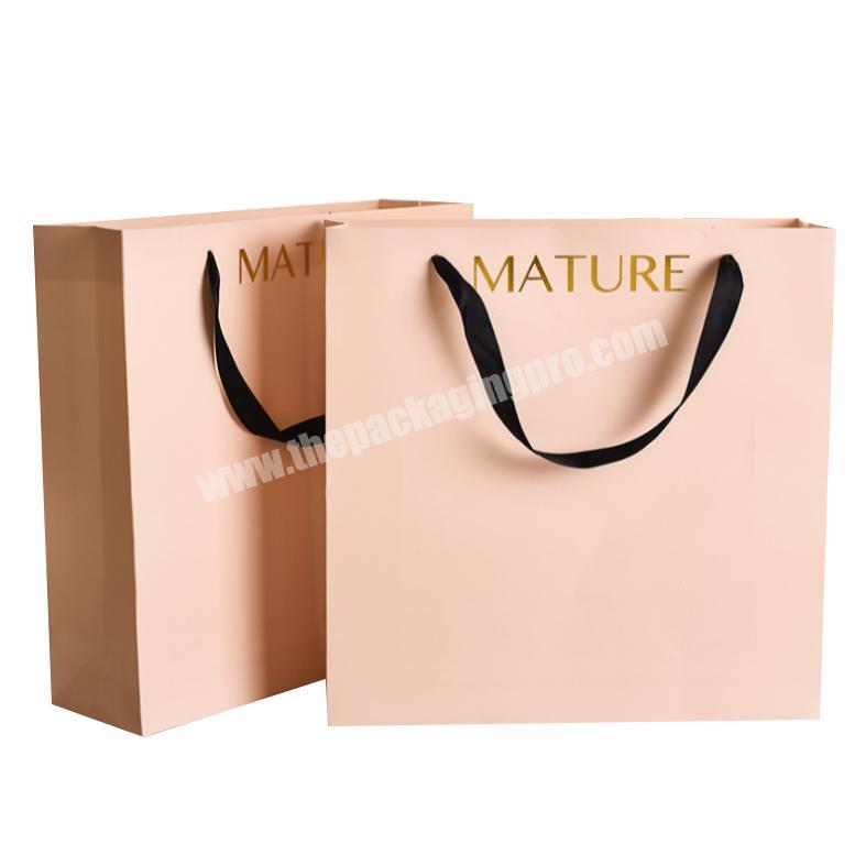 Made in China top sale wholesale custom gift craft paper bag with handle for shopping clothes shoe heel boots
