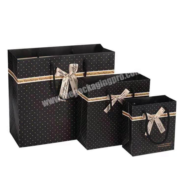 Manufacturer custom luxury black paper gift packaging bag with logo