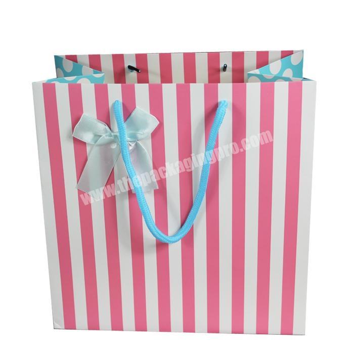 Manufacturers sell  cheap paper shopping bags with ribbon handle